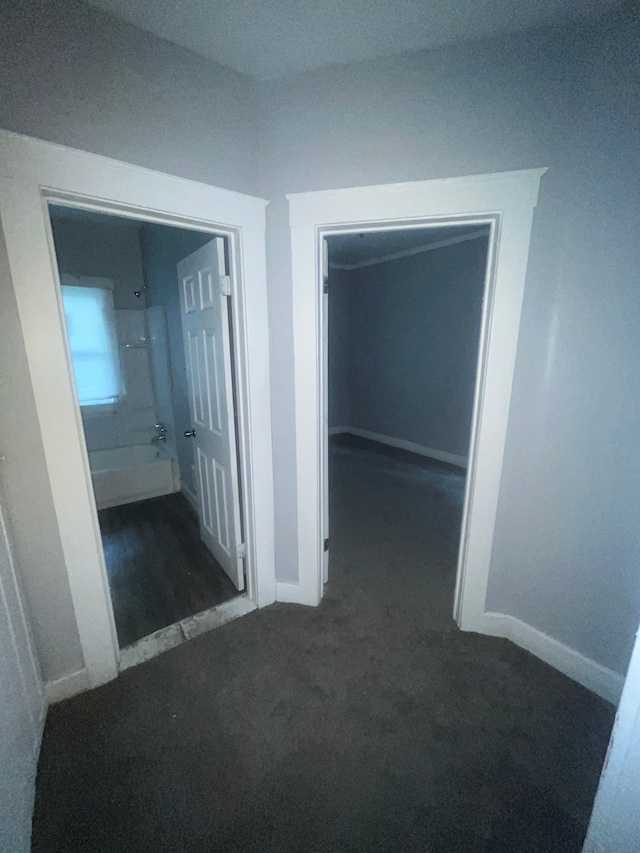 corridor with dark carpet