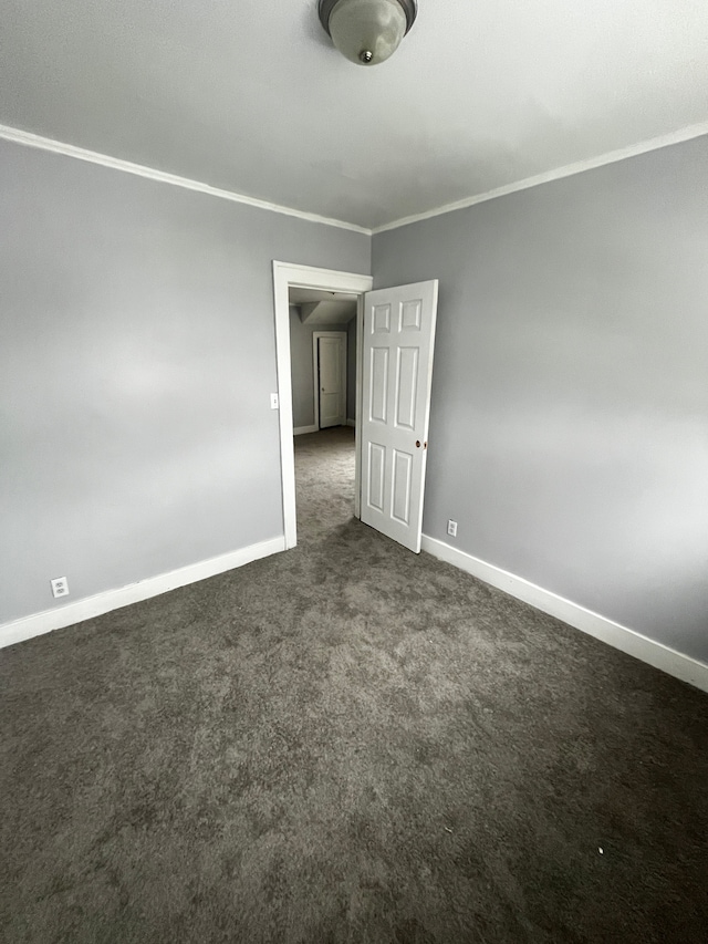 carpeted empty room with ornamental molding