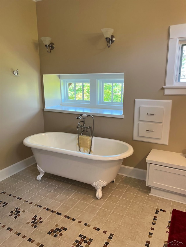 bathroom with tile patterned floors and a bathtub