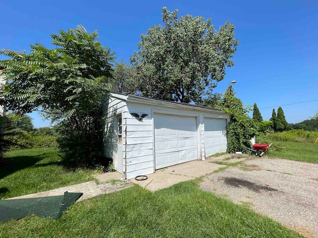 garage with a lawn