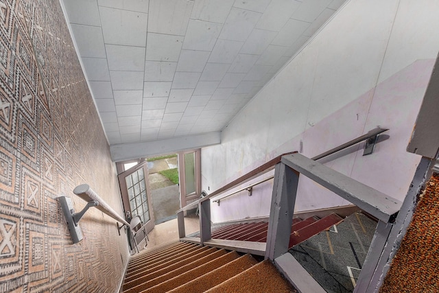 stairway with a towering ceiling