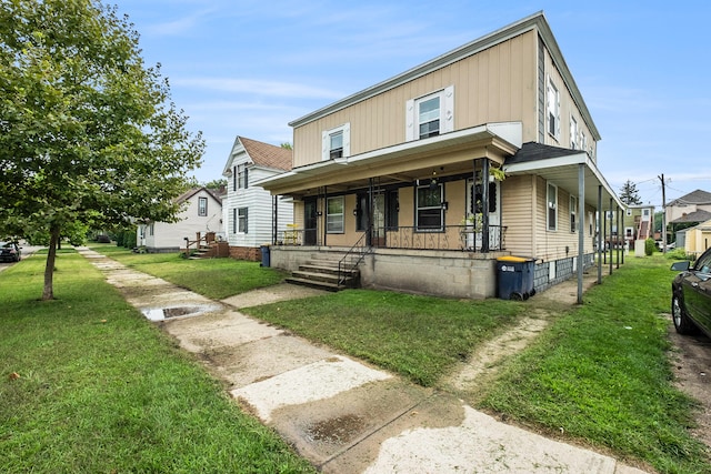 view of front of home featuring covered porch and a front lawn