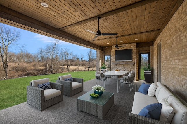 view of patio featuring outdoor lounge area and ceiling fan