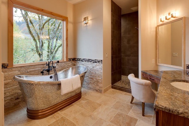 66930 Dorothy Trl, Washington, MI 48095 - bathroom featuring vanity, tile walls, a freestanding tub, a tile shower, and stone finish flooring