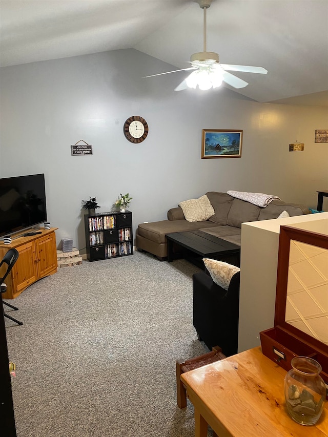 carpeted living room featuring ceiling fan and lofted ceiling