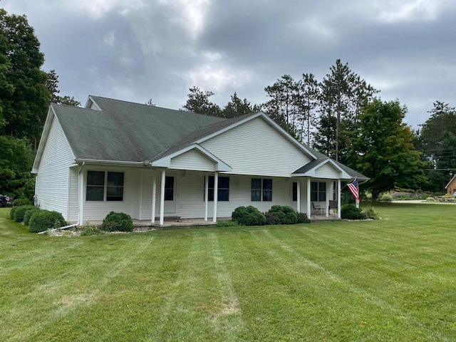 view of front facade with a front lawn and a porch