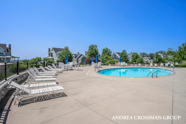 view of swimming pool featuring a patio