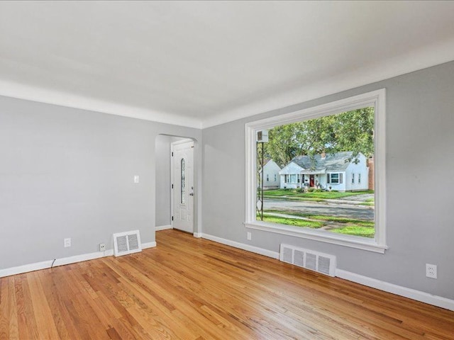 unfurnished room with light hardwood / wood-style floors