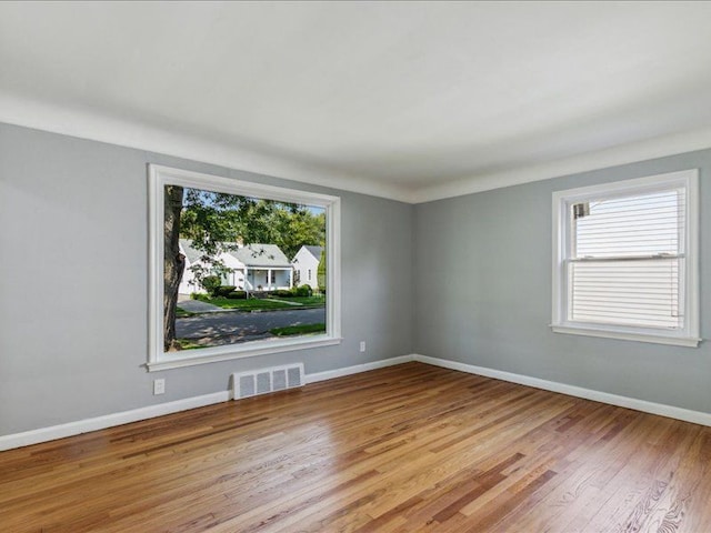 spare room featuring light hardwood / wood-style flooring