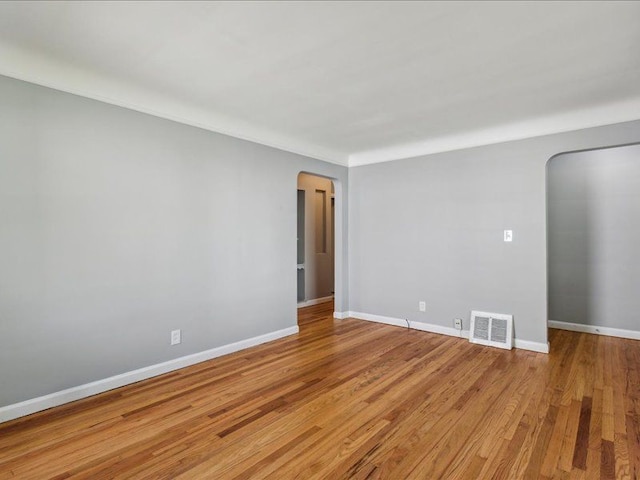 unfurnished room with light wood-type flooring