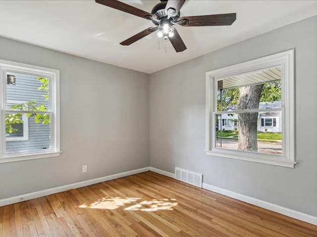 unfurnished room with light hardwood / wood-style floors and ceiling fan