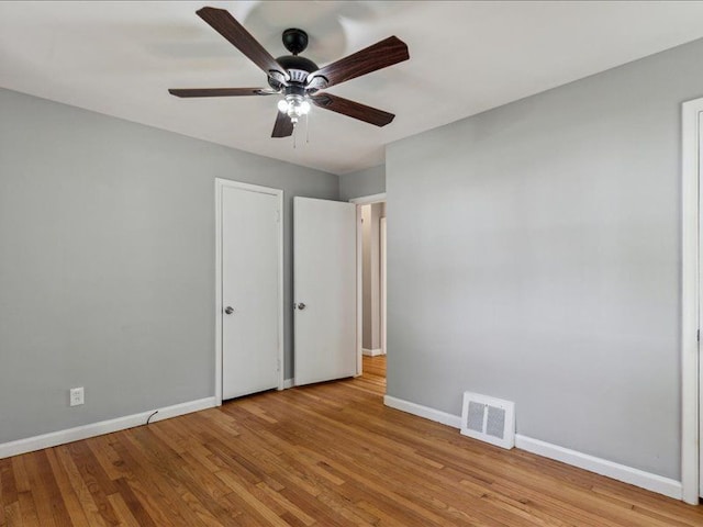 unfurnished bedroom with ceiling fan and light hardwood / wood-style flooring