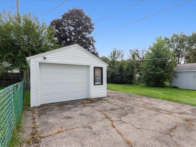 garage featuring a lawn