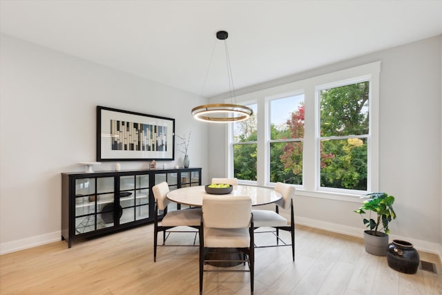 dining area with light wood-type flooring