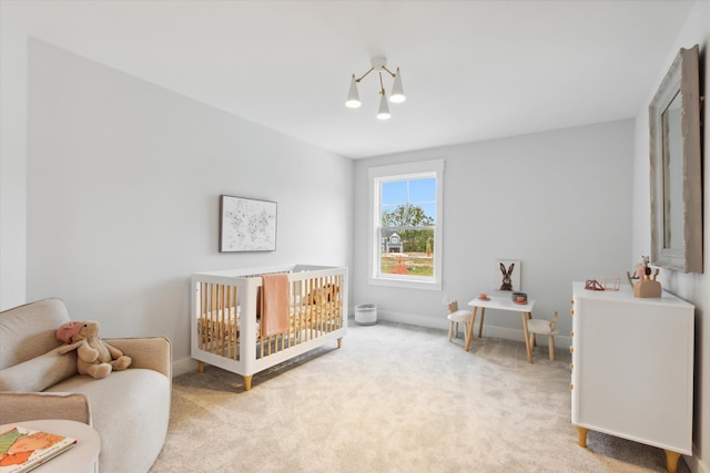 bedroom featuring light colored carpet and a crib