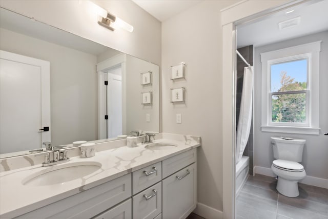 full bathroom featuring tile patterned flooring, vanity, toilet, and shower / bathtub combination with curtain