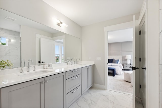 bathroom with vanity and tiled shower