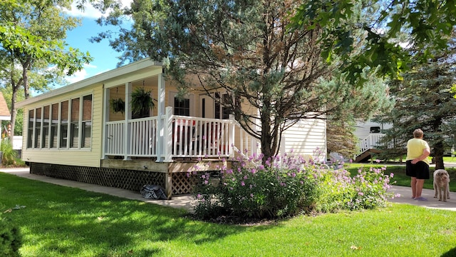 view of home's exterior featuring a yard