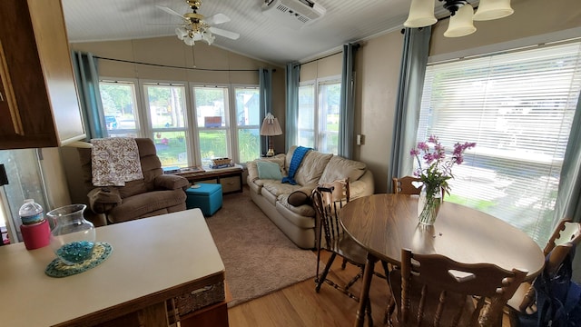 sunroom / solarium with ceiling fan and lofted ceiling