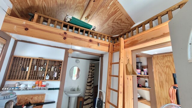 interior space with sink and wooden ceiling