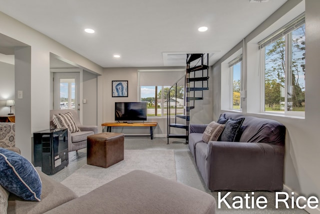 living room with light colored carpet and a wealth of natural light