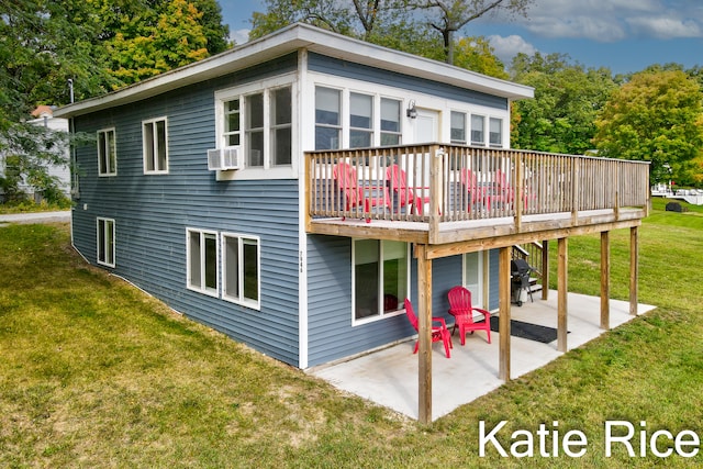 back of property with a deck, a lawn, a patio area, and cooling unit