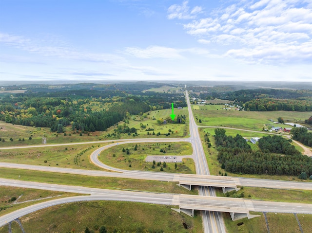 birds eye view of property featuring a rural view