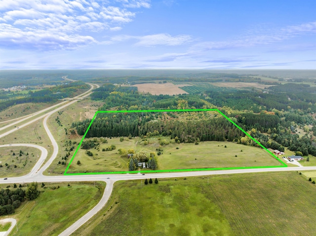 birds eye view of property featuring a rural view