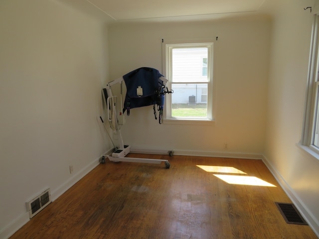 workout room featuring dark hardwood / wood-style flooring