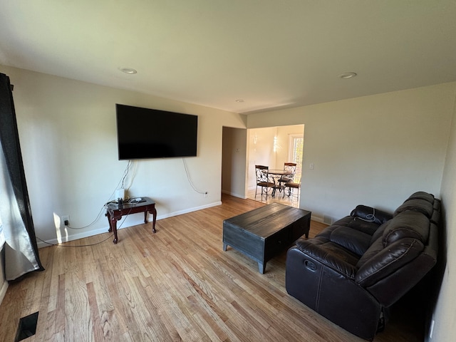 living room with light hardwood / wood-style flooring