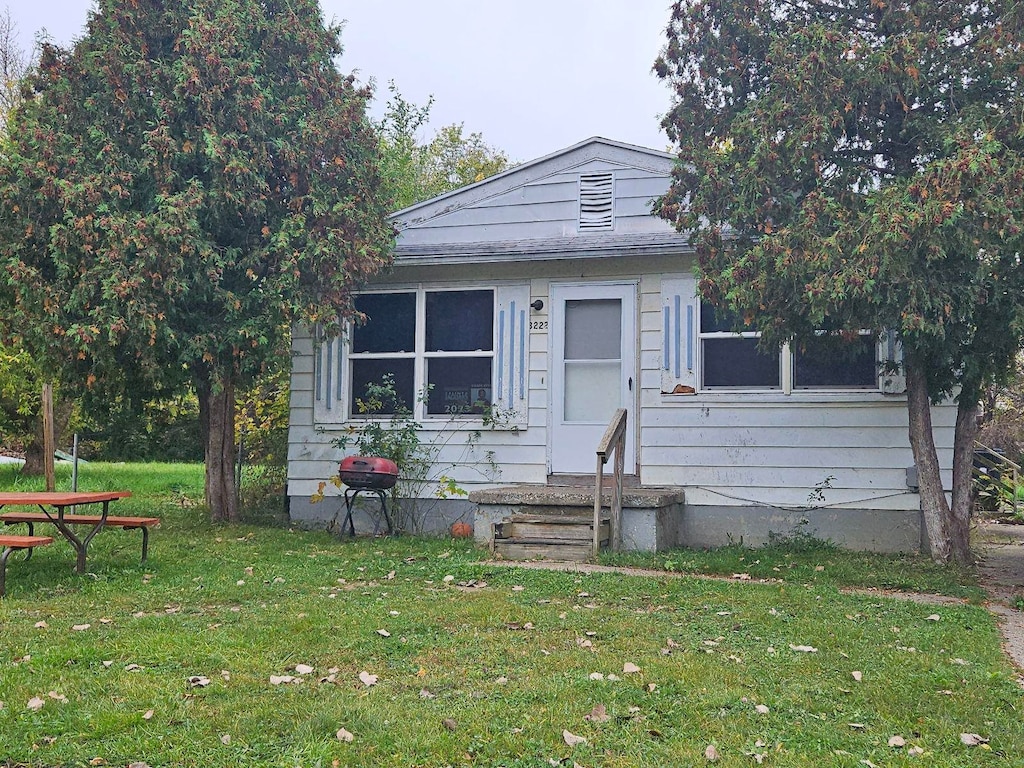 bungalow with a front yard