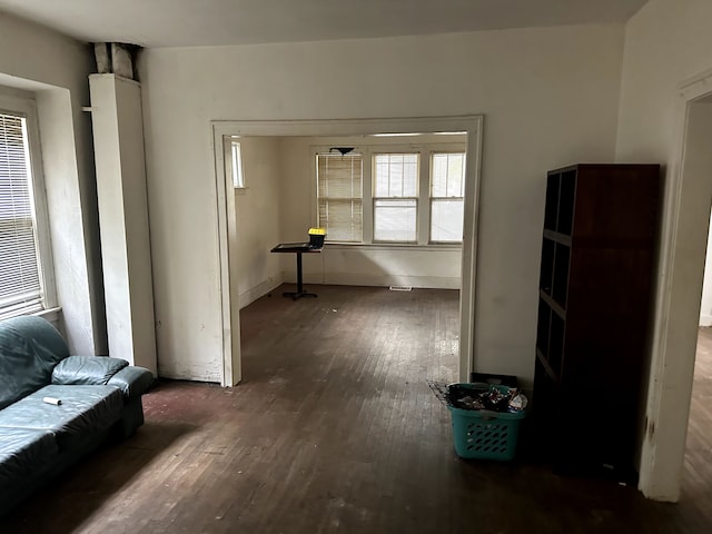 hallway featuring dark hardwood / wood-style flooring