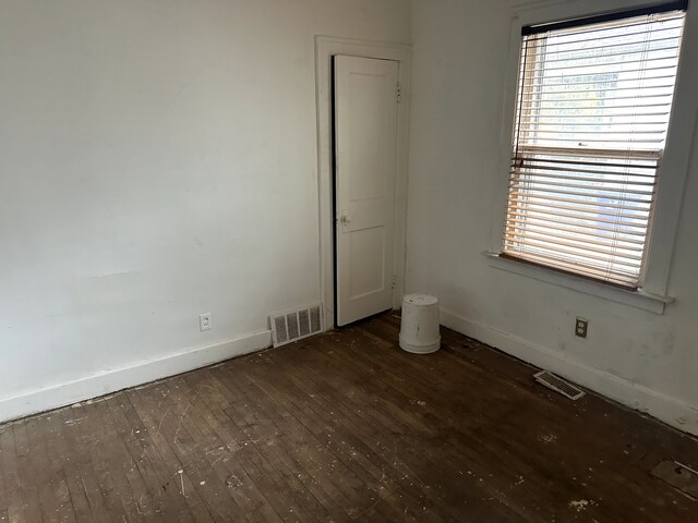 3950 Cadieux Rd, Detroit, MI 48224 - empty room with wood-type flooring, baseboards, and healthy amount of natural light