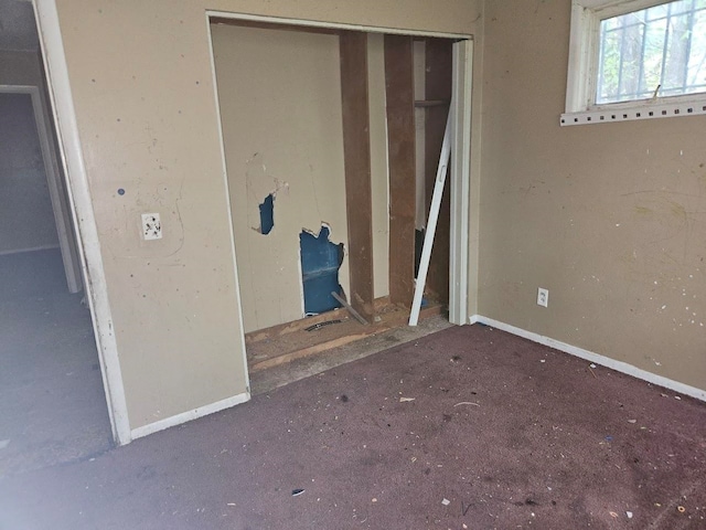 unfurnished bedroom featuring a closet and carpet floors