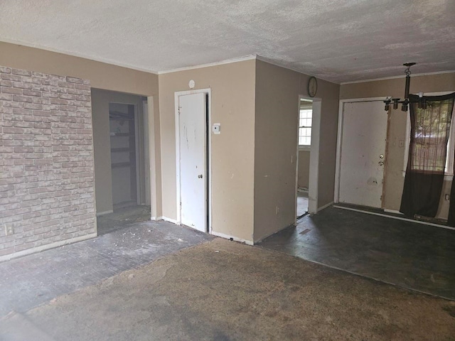 empty room featuring a textured ceiling