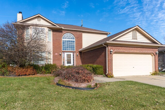 view of front property with a front lawn and a garage