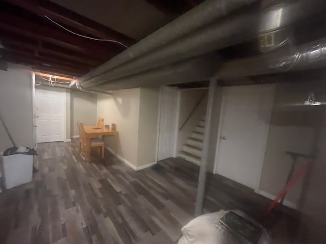 basement featuring dark hardwood / wood-style floors