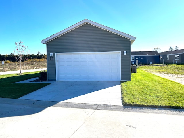 garage featuring central AC and a yard