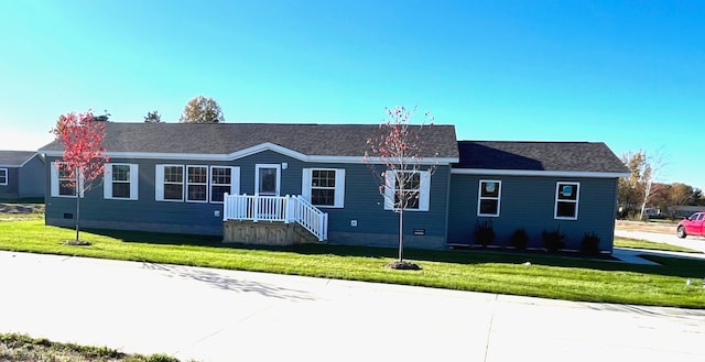 ranch-style house with a front lawn