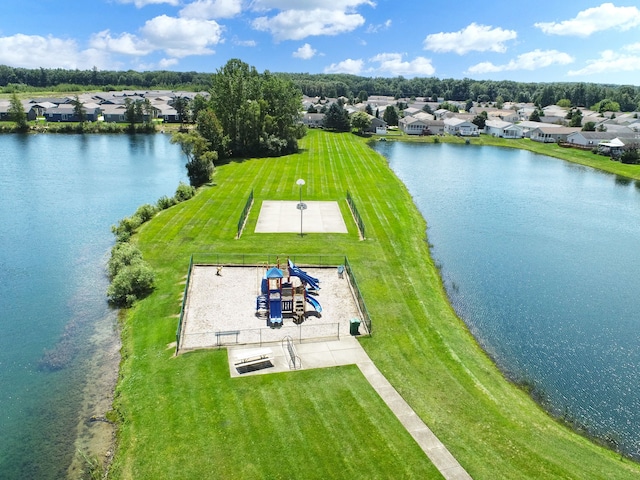 birds eye view of property featuring a water view