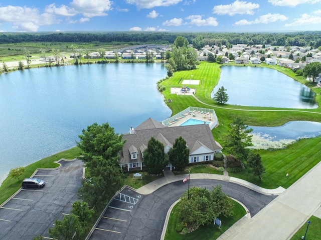 birds eye view of property featuring a water view