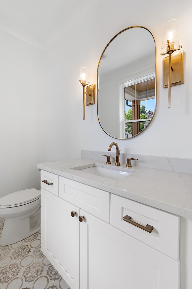 bathroom with vanity and toilet