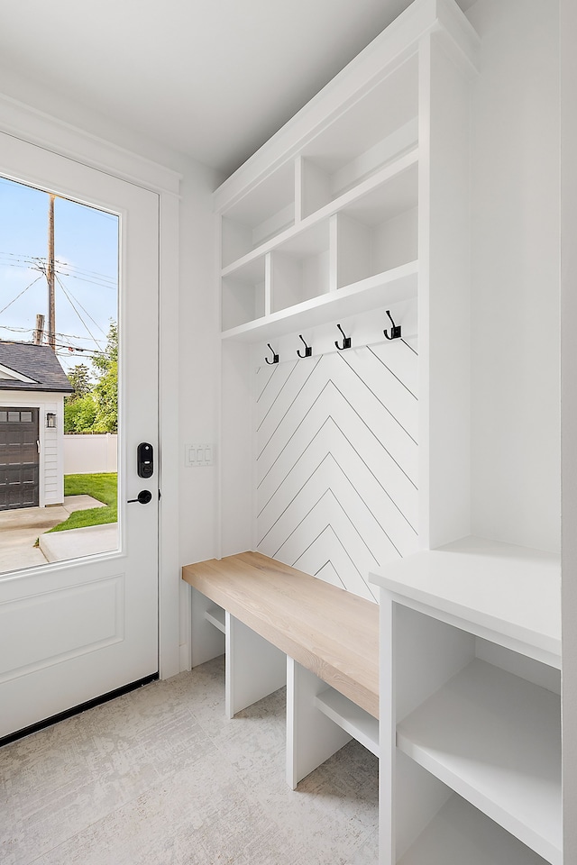 mudroom featuring light colored carpet