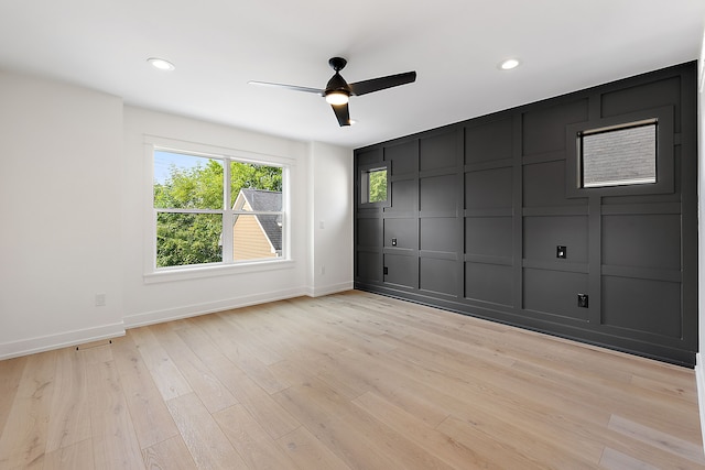 unfurnished room with light hardwood / wood-style flooring and ceiling fan