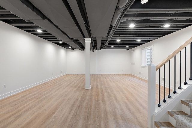 basement featuring light wood-type flooring