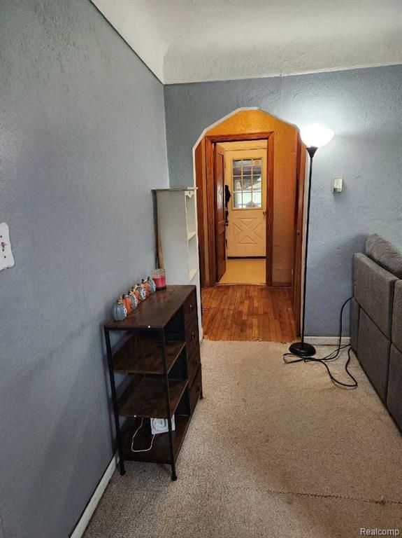 6000 N Dort Hwy, Flint, MI 48505 - corridor featuring carpet flooring, baseboards, and arched walkways