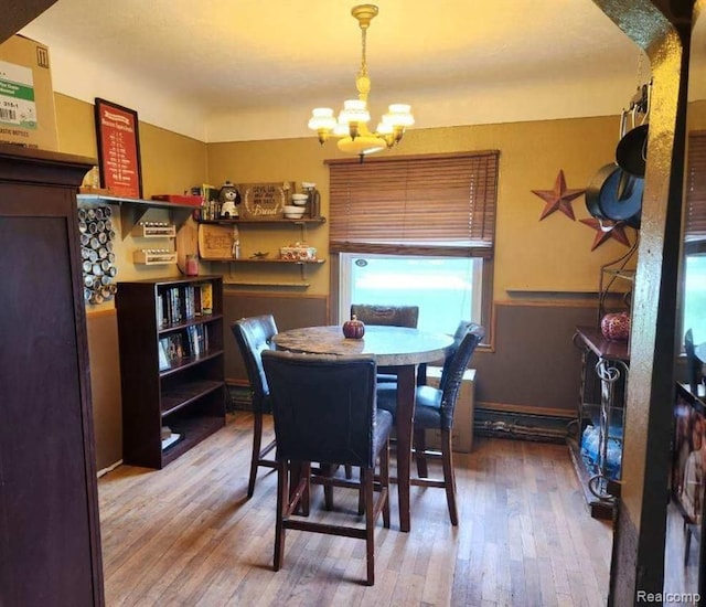6000 N Dort Hwy, Flint, MI 48505 - dining space featuring a chandelier, wood-type flooring, and arched walkways