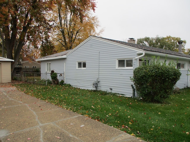 view of property exterior featuring a yard