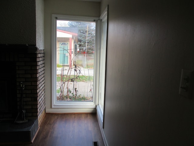 doorway to outside featuring dark hardwood / wood-style flooring