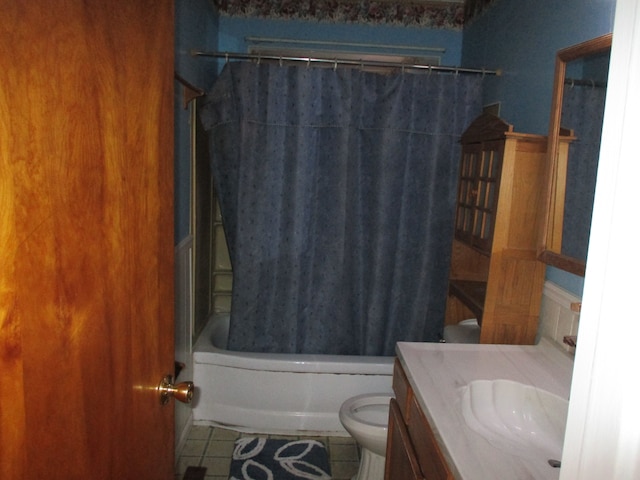 full bathroom with toilet, tile patterned floors, vanity, and shower / tub combo with curtain